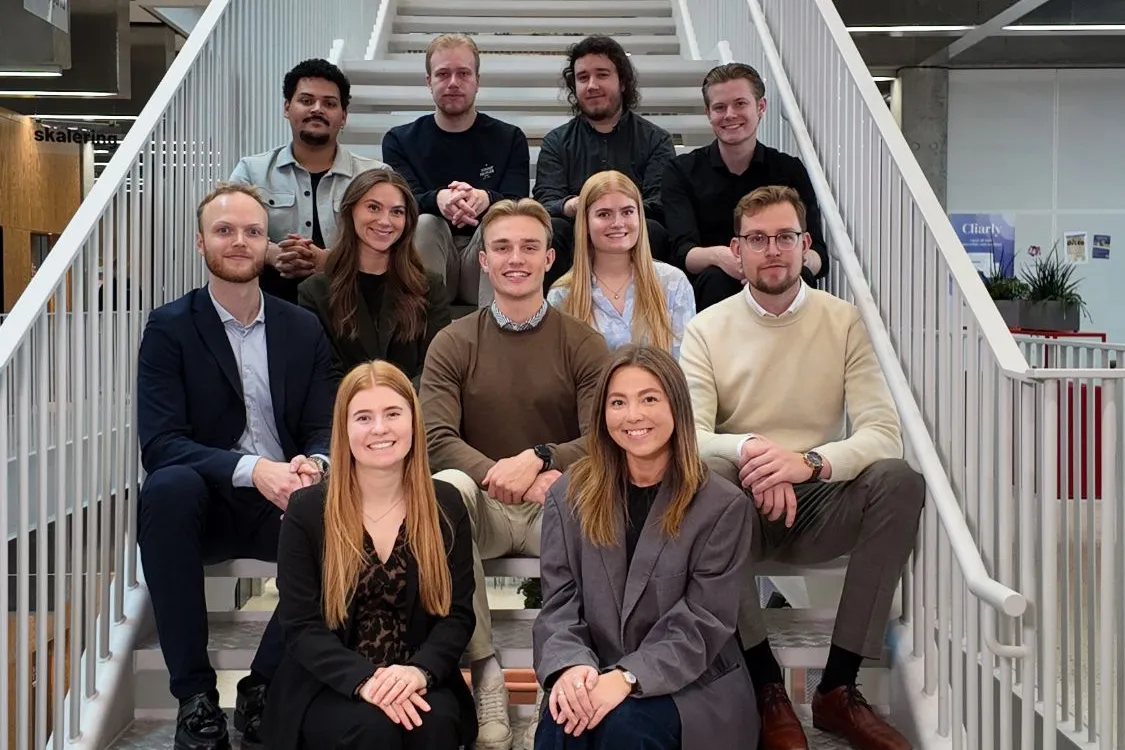 The team behind TrailBlaze - the founders and the volunteers - gathered on a staircase